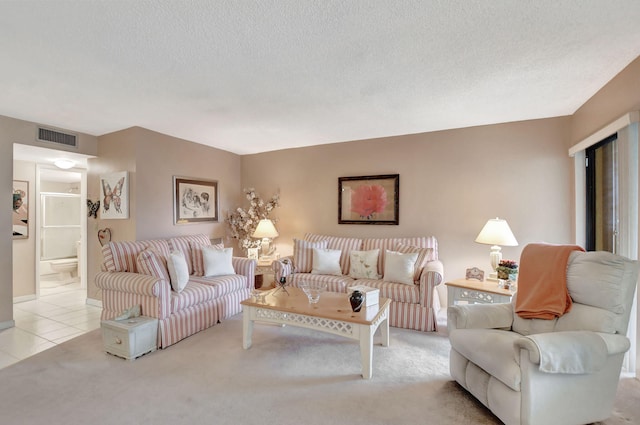 carpeted living room with a textured ceiling