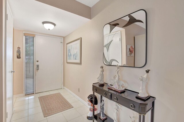 dining area with light tile patterned flooring and a chandelier