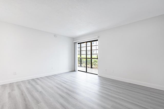 empty room with light wood-type flooring