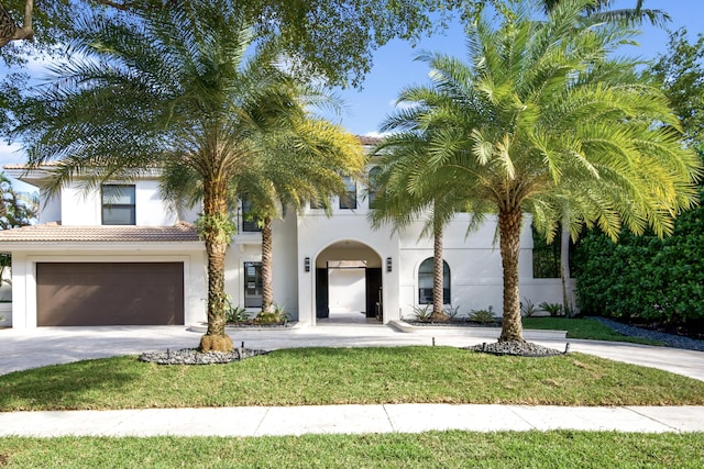 mediterranean / spanish house with a garage