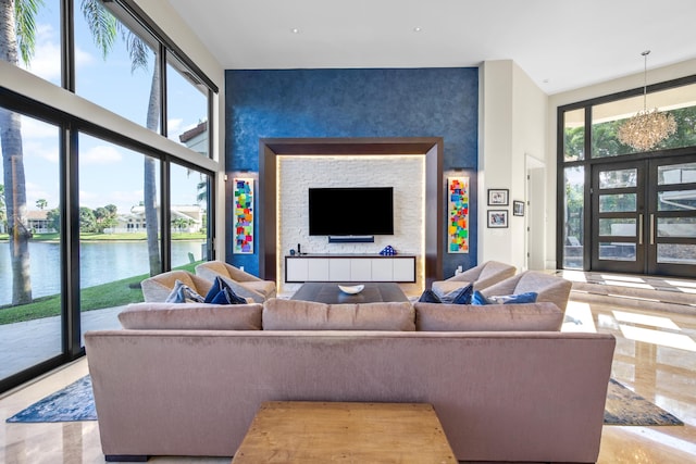 living room featuring a high ceiling and an inviting chandelier