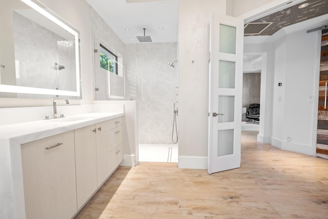 bathroom featuring vanity and a shower