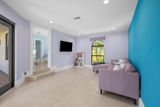 living room with light hardwood / wood-style flooring