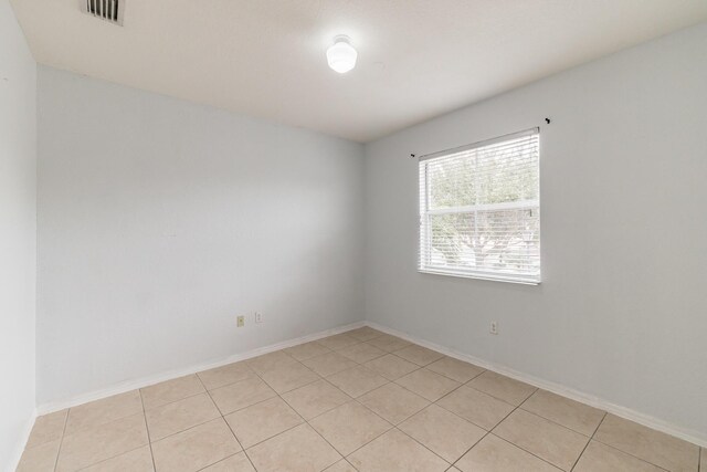 view of tiled spare room