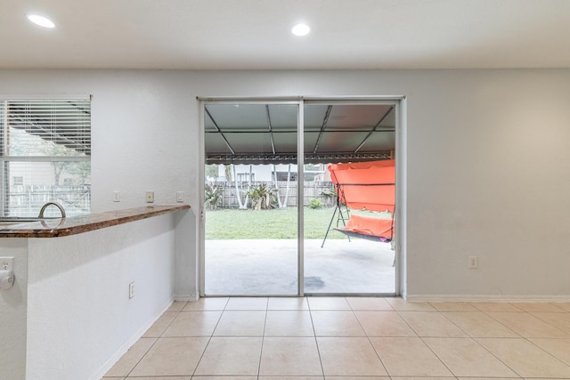 entryway featuring light tile patterned floors