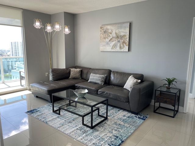 living room featuring light tile patterned flooring and a wall of windows