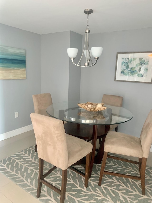 dining space featuring an inviting chandelier