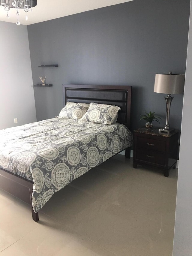 bedroom featuring light tile patterned floors