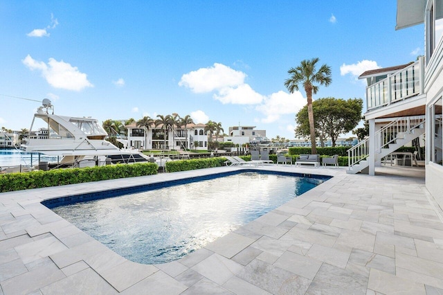 view of swimming pool with a patio area