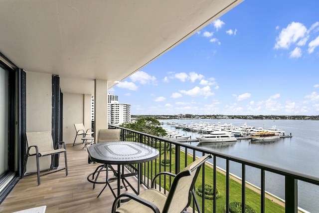 balcony featuring a water view