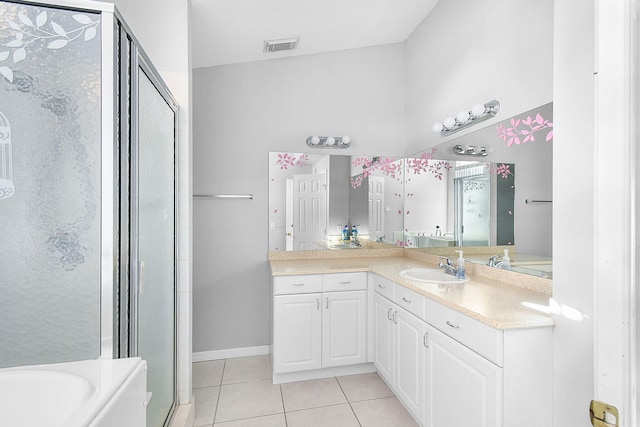 bathroom featuring independent shower and bath, tile patterned flooring, and vanity