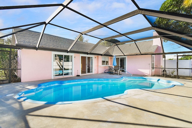 view of pool with a lanai and a patio area