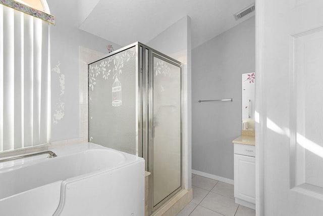 bathroom featuring tile patterned flooring and independent shower and bath