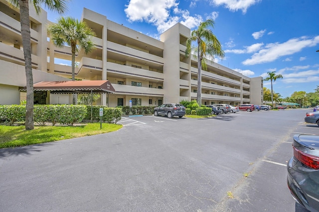 3154 Via Poinciana Unit 306, Lake Worth, FL 33467 - view of property with uncovered parking