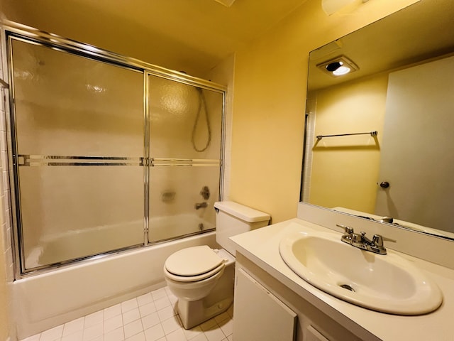 full bathroom with toilet, vanity, tile patterned floors, and shower / bath combination with glass door