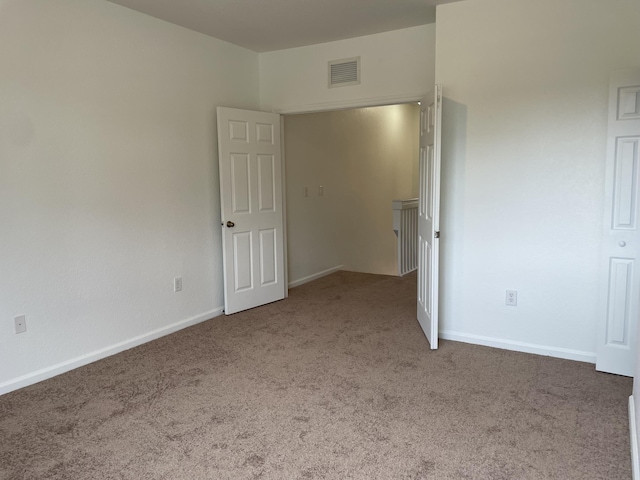 unfurnished bedroom featuring carpet