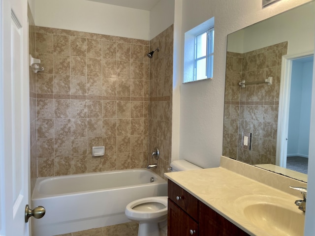 full bathroom with toilet, tiled shower / bath combo, tile patterned floors, and vanity