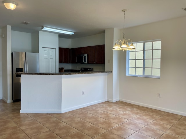 kitchen with appliances with stainless steel finishes, kitchen peninsula, a notable chandelier, light tile patterned flooring, and dark brown cabinets