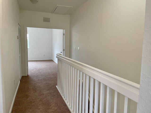 hallway with dark carpet