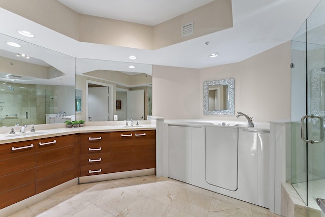 bathroom featuring vanity and a shower with door