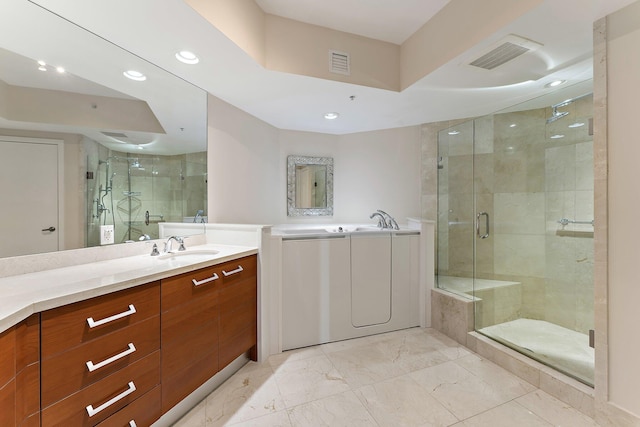 bathroom featuring vanity and an enclosed shower