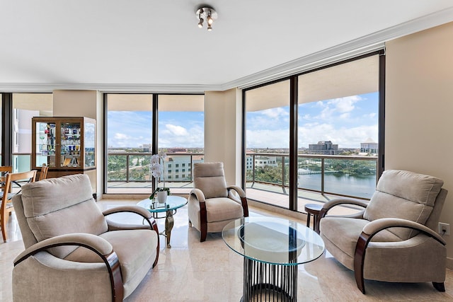 living room with crown molding, expansive windows, and a water view