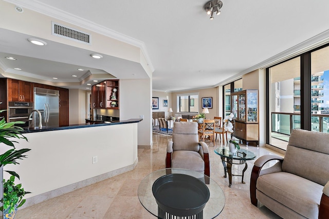 living room featuring crown molding and a tray ceiling