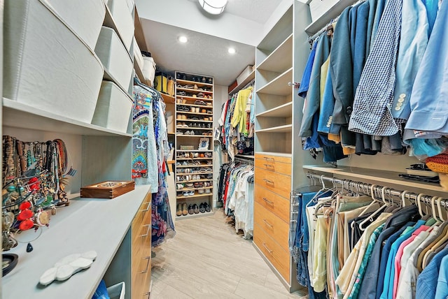 walk in closet featuring light hardwood / wood-style floors