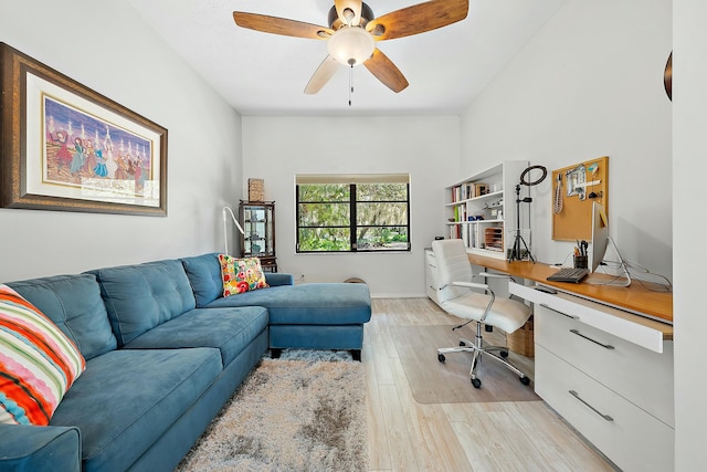 home office featuring ceiling fan and light hardwood / wood-style floors