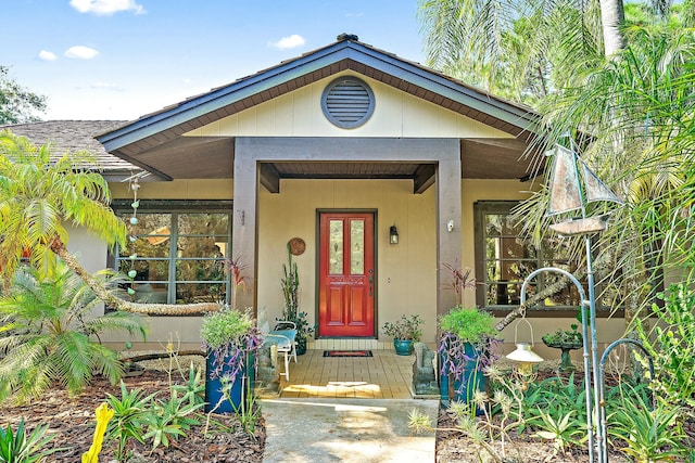 view of exterior entry with covered porch