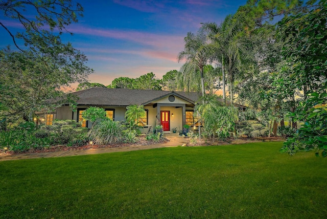 view of front of property with a yard