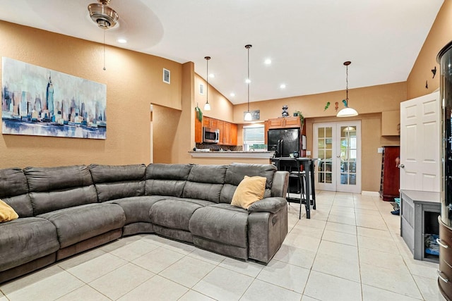 living room featuring vaulted ceiling, french doors, ceiling fan, and light tile patterned floors