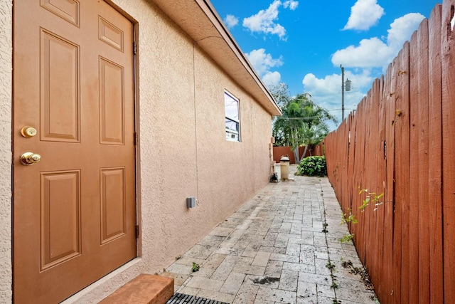 view of side of home with a patio