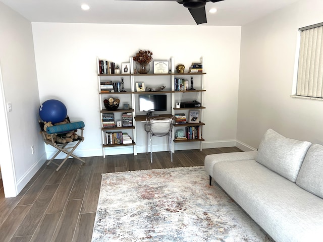 living area featuring ceiling fan