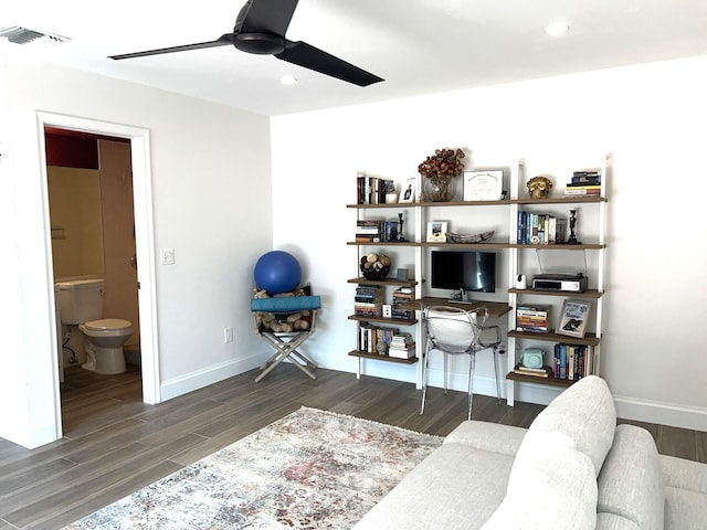 interior space featuring ceiling fan and dark hardwood / wood-style flooring