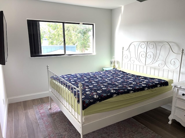 bedroom featuring dark hardwood / wood-style flooring