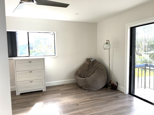 unfurnished room with ceiling fan and light hardwood / wood-style flooring