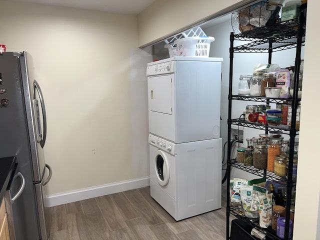 laundry area featuring stacked washer and dryer