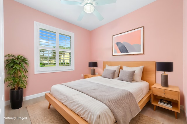 bedroom featuring ceiling fan and light hardwood / wood-style floors