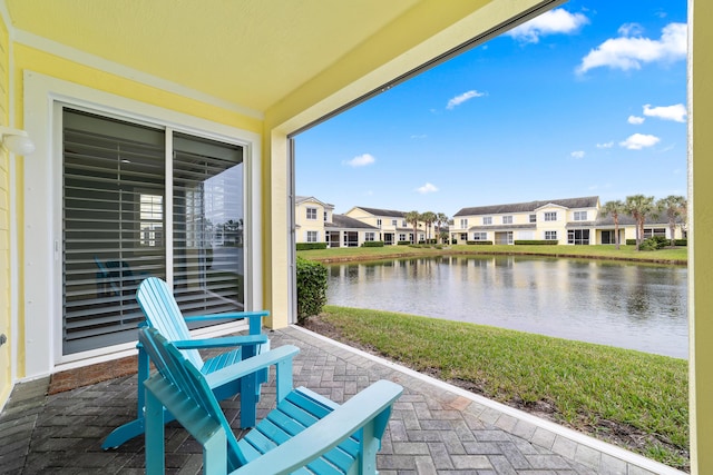 view of patio featuring a water view