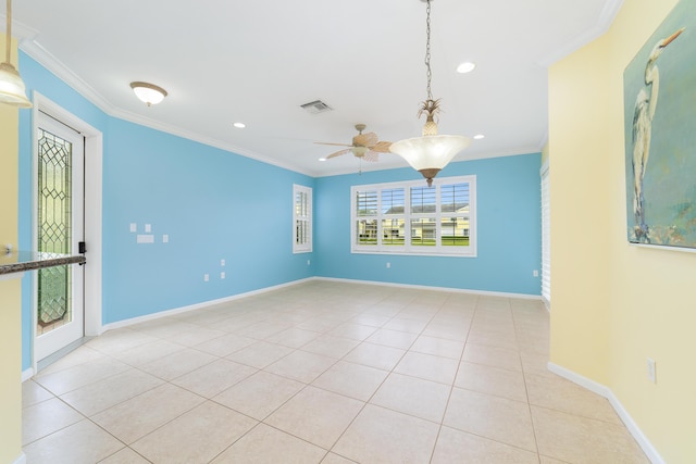 tiled empty room featuring ceiling fan and crown molding