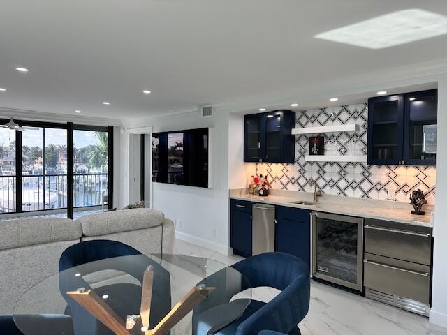 bar featuring wine cooler, recessed lighting, visible vents, backsplash, and indoor wet bar