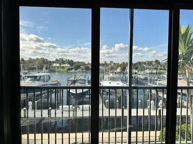 interior space with a water view and a healthy amount of sunlight