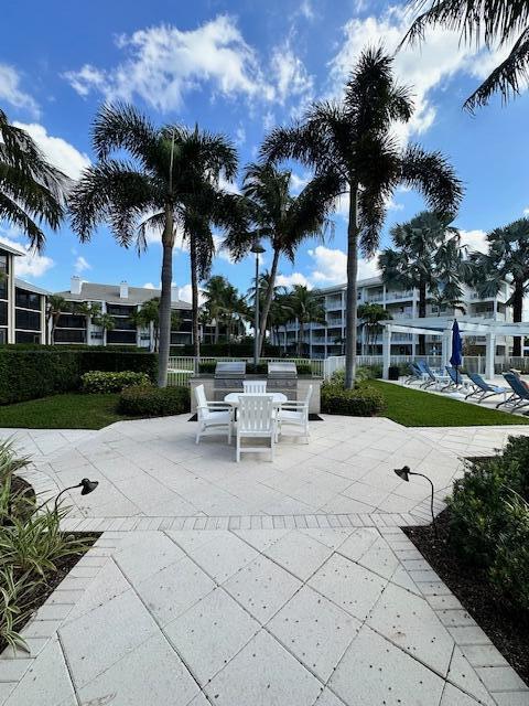 view of home's community with a patio area