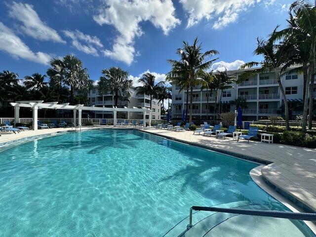 community pool featuring a patio area and a pergola