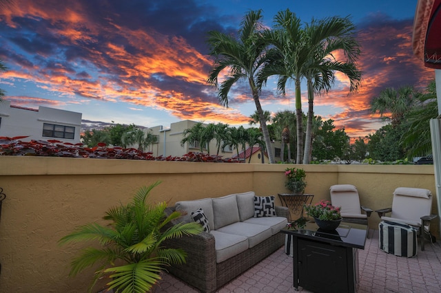 patio terrace at dusk featuring outdoor lounge area