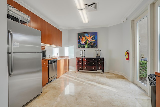 kitchen featuring stainless steel appliances, brown cabinets, visible vents, and ornamental molding