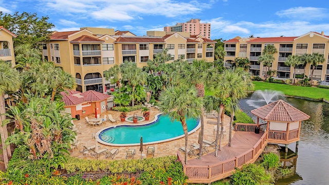 view of swimming pool featuring a water view