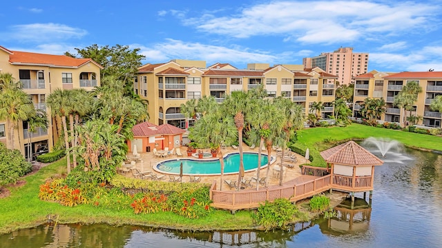 exterior space with a patio area and a water view