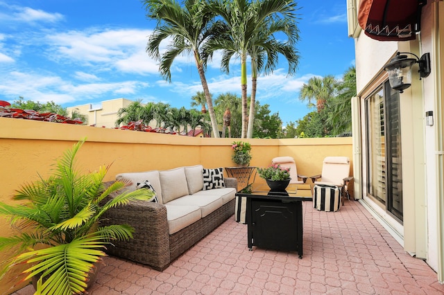 view of patio with fence and an outdoor living space